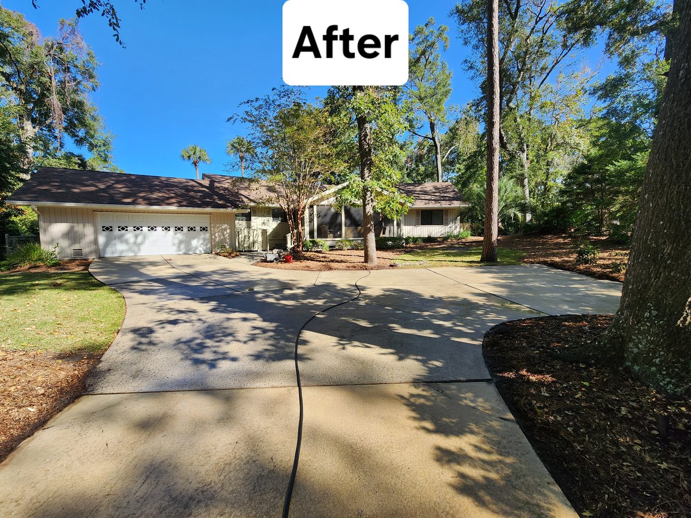 Concrete driveway and front walk after pressure washing in Hilton Head, SC