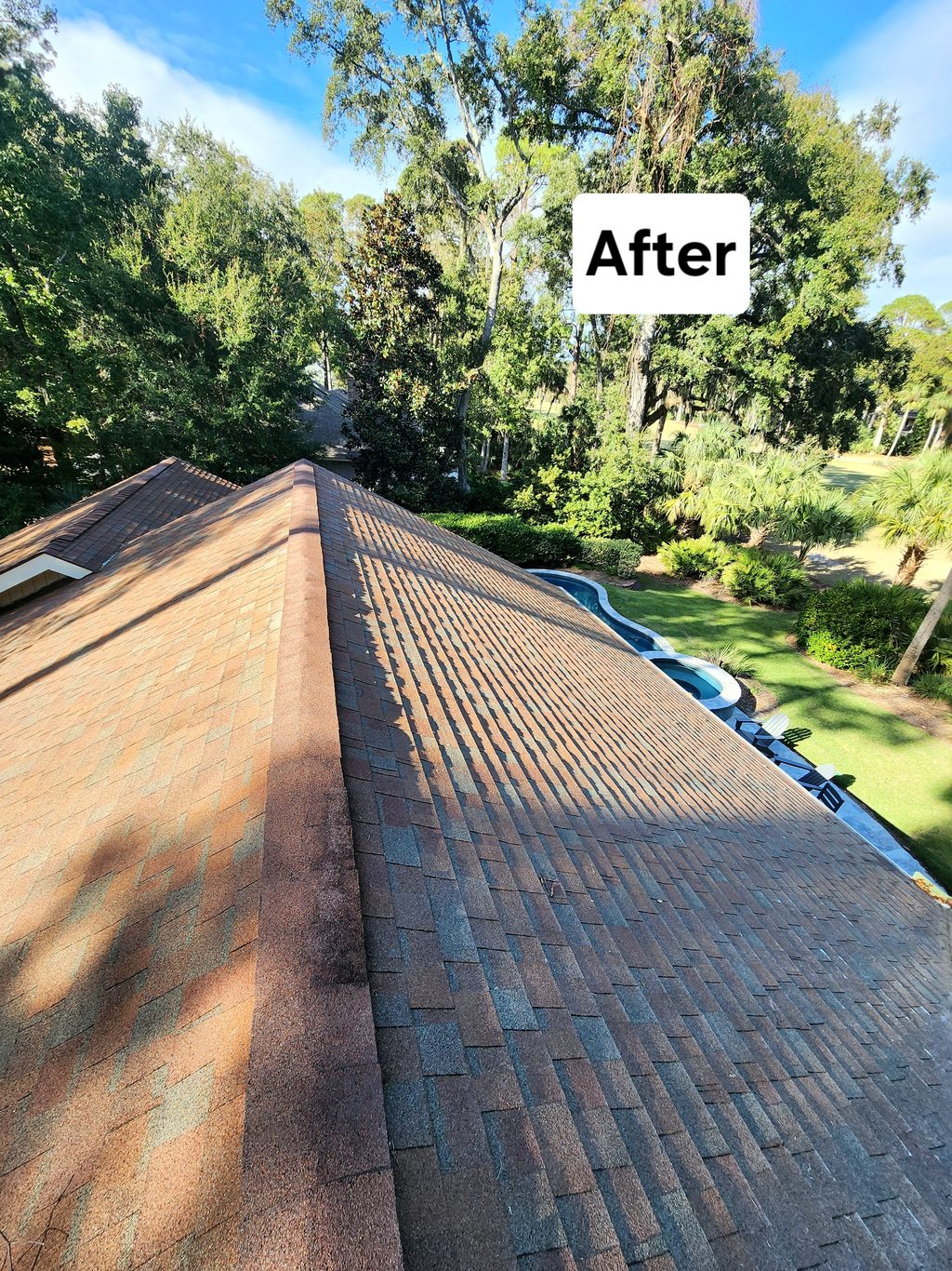 Clean shingle ridge line after roof soft washing in Hilton Head, SC